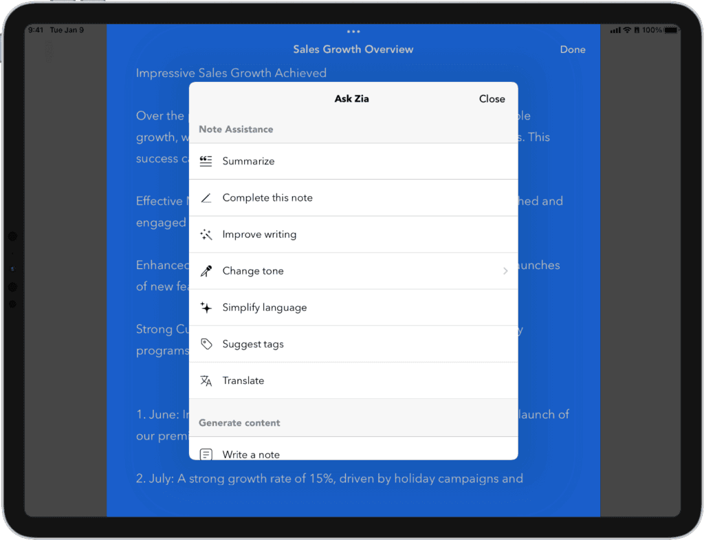 An iPad displaying the Notebook app with a 'Sales Growth Overview' document open. A blue background contains business text about sales growth, with visible bullet points including June and July monthly results. In the foreground, an 'Ask Zia' AI assistant popup menu shows various note enhancement options including 'Summarize,' 'Complete this note,' 'Improve writing,' 'Change tone,' 'Simplify language,' 'Suggest tags,' 'Translate,' and 'Write a note.' The AI assistant feature demonstrates Notebook's smart writing capabilities.